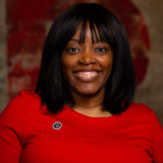 Headshot of Stacey Chavis, a Black woman wearing a red blouse.