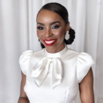 Headshot of Olyvia Troop, a Black woman wearing red lipstick and a white blouse