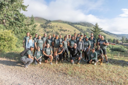 Group of 30 Americans of different backgrounds hiking in Montana wearing MPU tshirts.