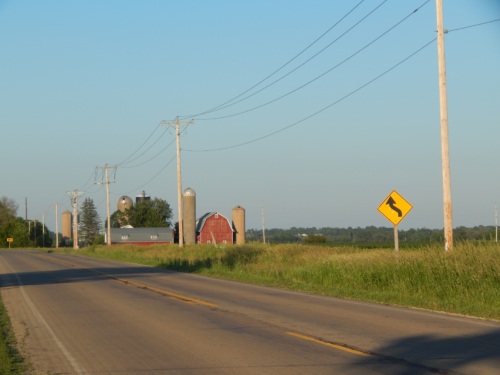 Street view of a farm with a barn