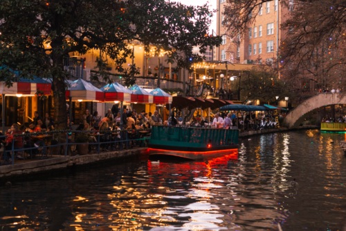 ferry boat on the san antonio river at dusk