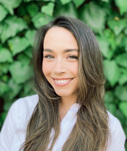 headshot of Megan Smith, a 30 something year old white woman with long brown hair