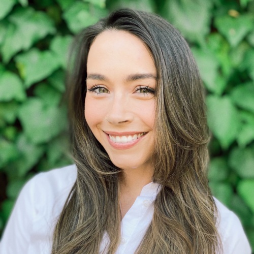 headshot of Megan Smith, a 30 something year old white woman with long brown hair