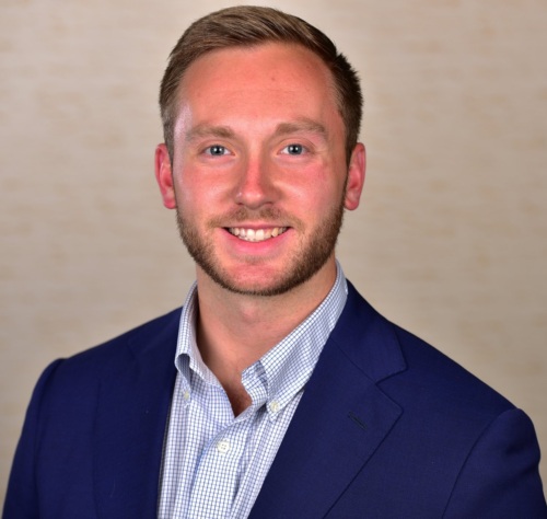 Headshot of Austin Jackson, a white man wearing a suit.