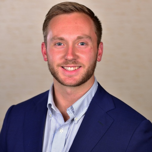 Headshot of Austin Jackson, a white man wearing a suit.